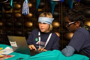 A student (left) from Pleasant Hill Elementary School collaborates with a teammate during the carnival at Khan Academy’s LearnStorm Final event at Levi’s Stadium on Saturday, May 7th, 2016. photos by David Kong