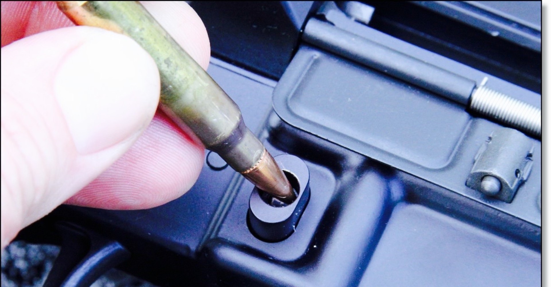 A California-legal bullet button on a semiautomatic rifle. (www.gunsamerica.com)