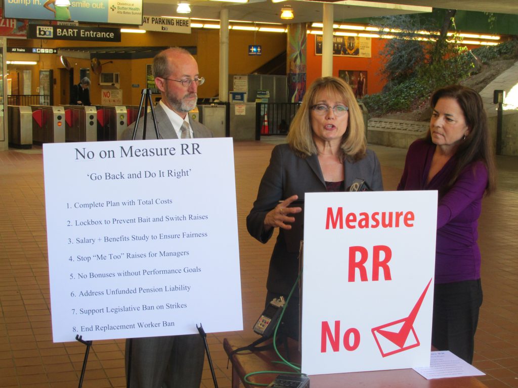 BART Director candidate Debora Allen speaks at a news conference to oppose BART bond Measure RR, as State Senator Steve Glazer and fellow candidate Jennifer Hostermann listen at the Lafayette BART Station on Wednesday, October 26, 2016. Photo special to the Herald.