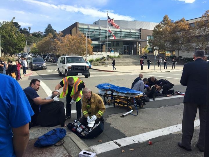 Martinez Police Officers, County Sheriff Deputies and ConFire personnel attend to three victims of a hit and run, at the intersection of Court and Main Streets in Martinez, Monday morning, November 7, 2016. Photo by Angrett Davies
